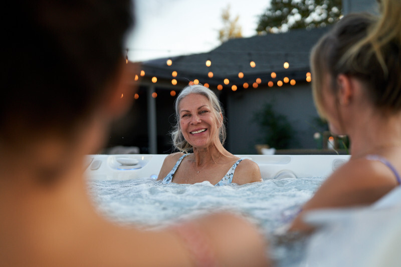 Caldera Utopia Series spa on a patio at dusk